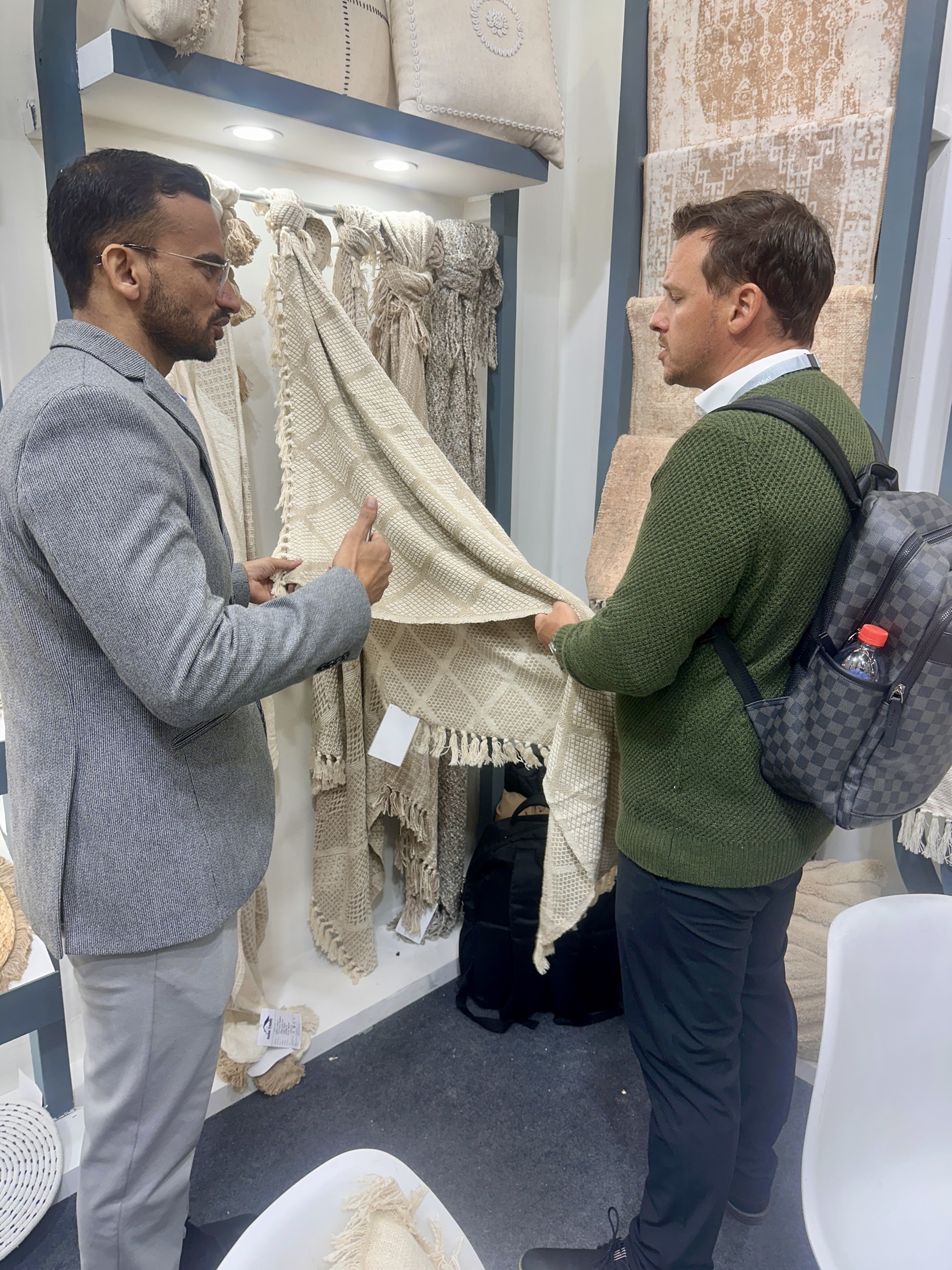 Discussing a Home Trends Overseas product collection with a visitor